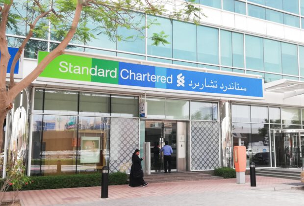 standard chartered jobs cut